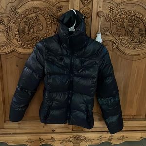 Michael Kors puffer with a higher and flared collar. Warm, black, with pockets